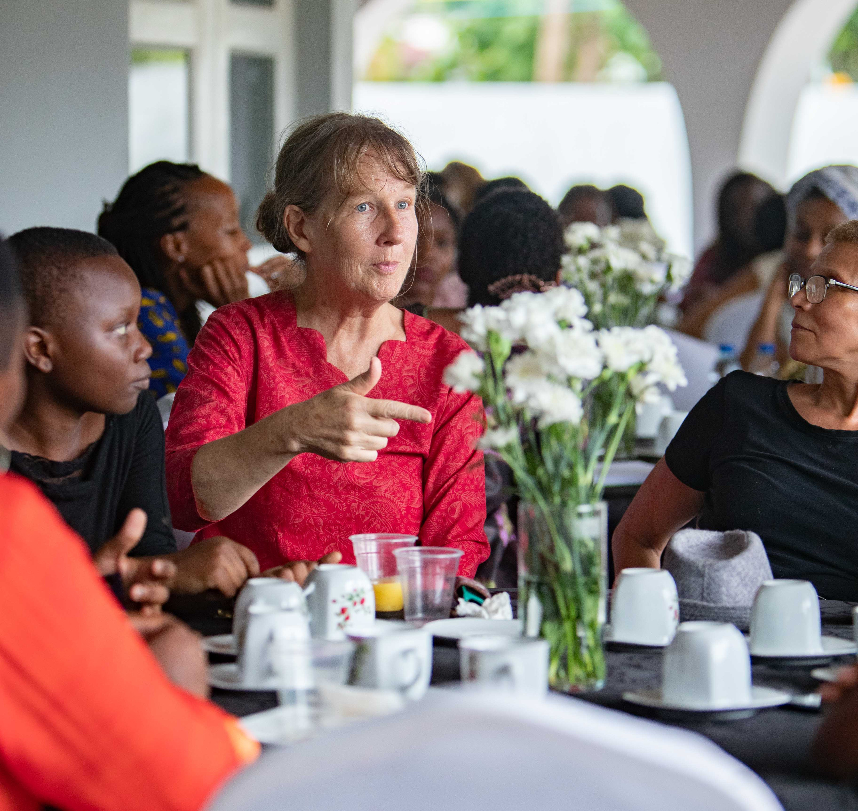 Women share tea and conversation