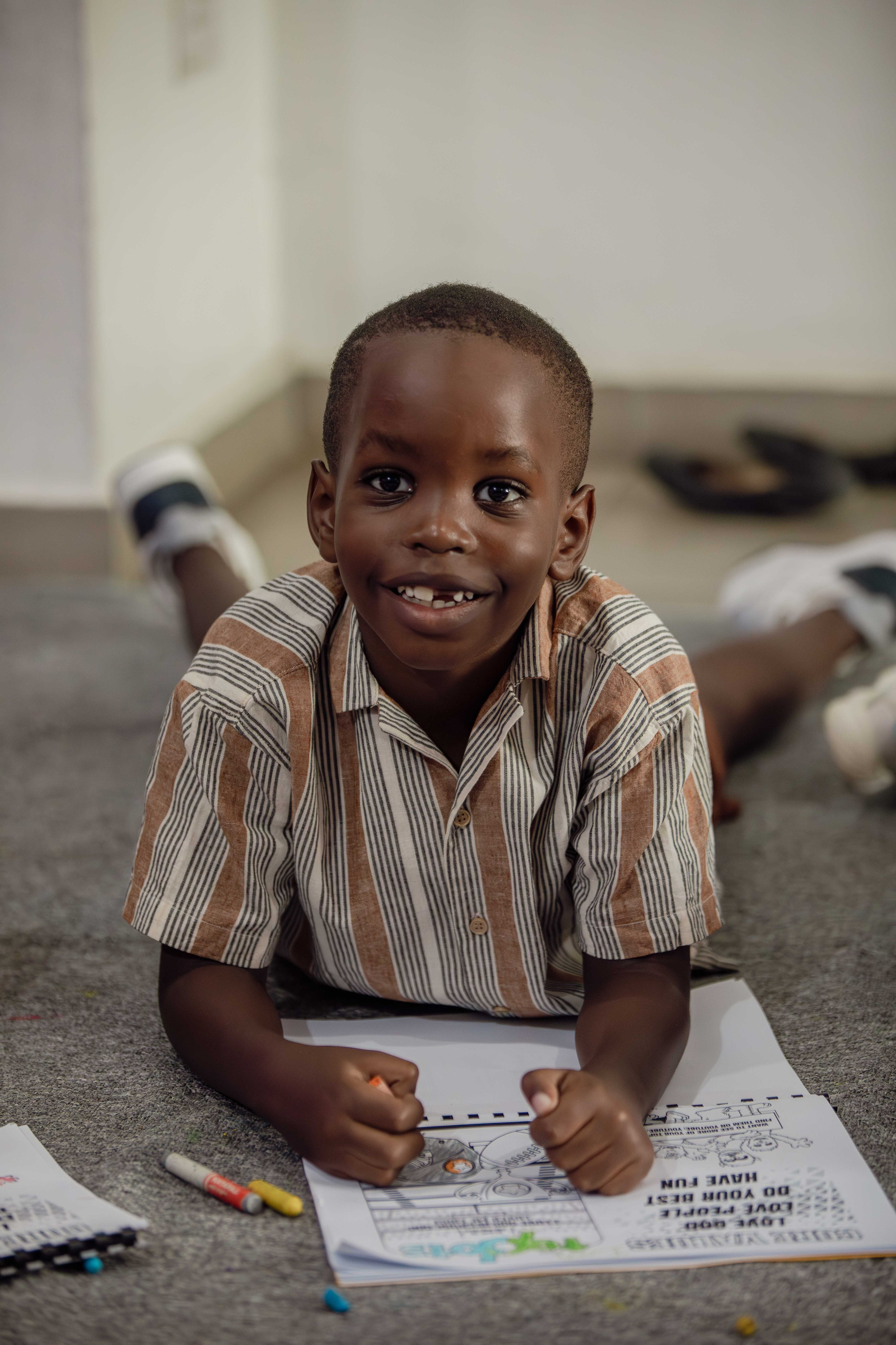 Children draw together at a table
