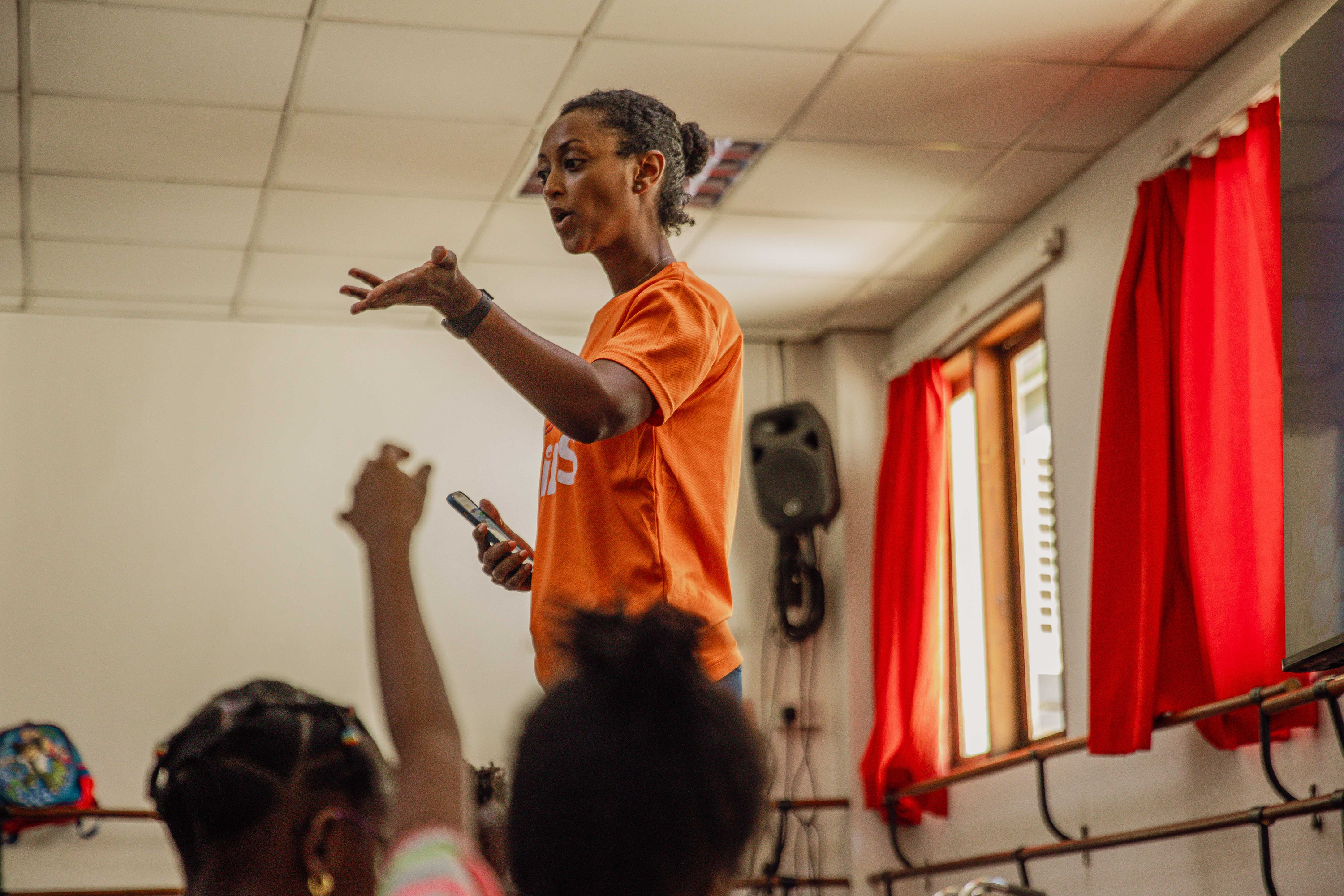 A kids leader teaches a room of children at Ocean Kids
